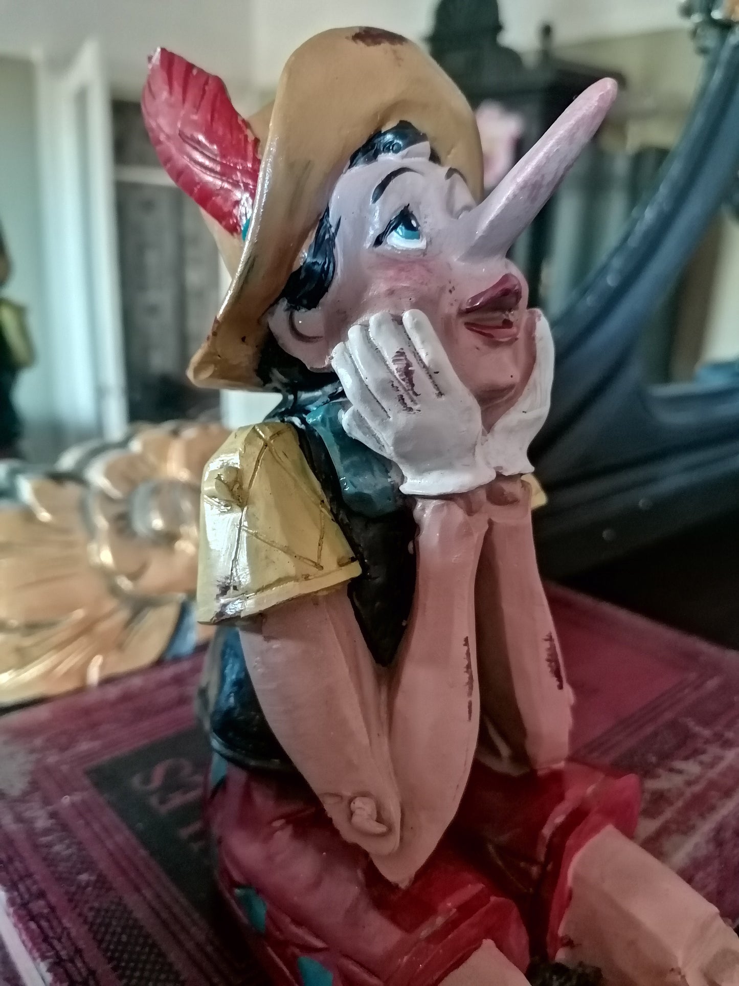 Antiqued Sitting Pinocchio figure