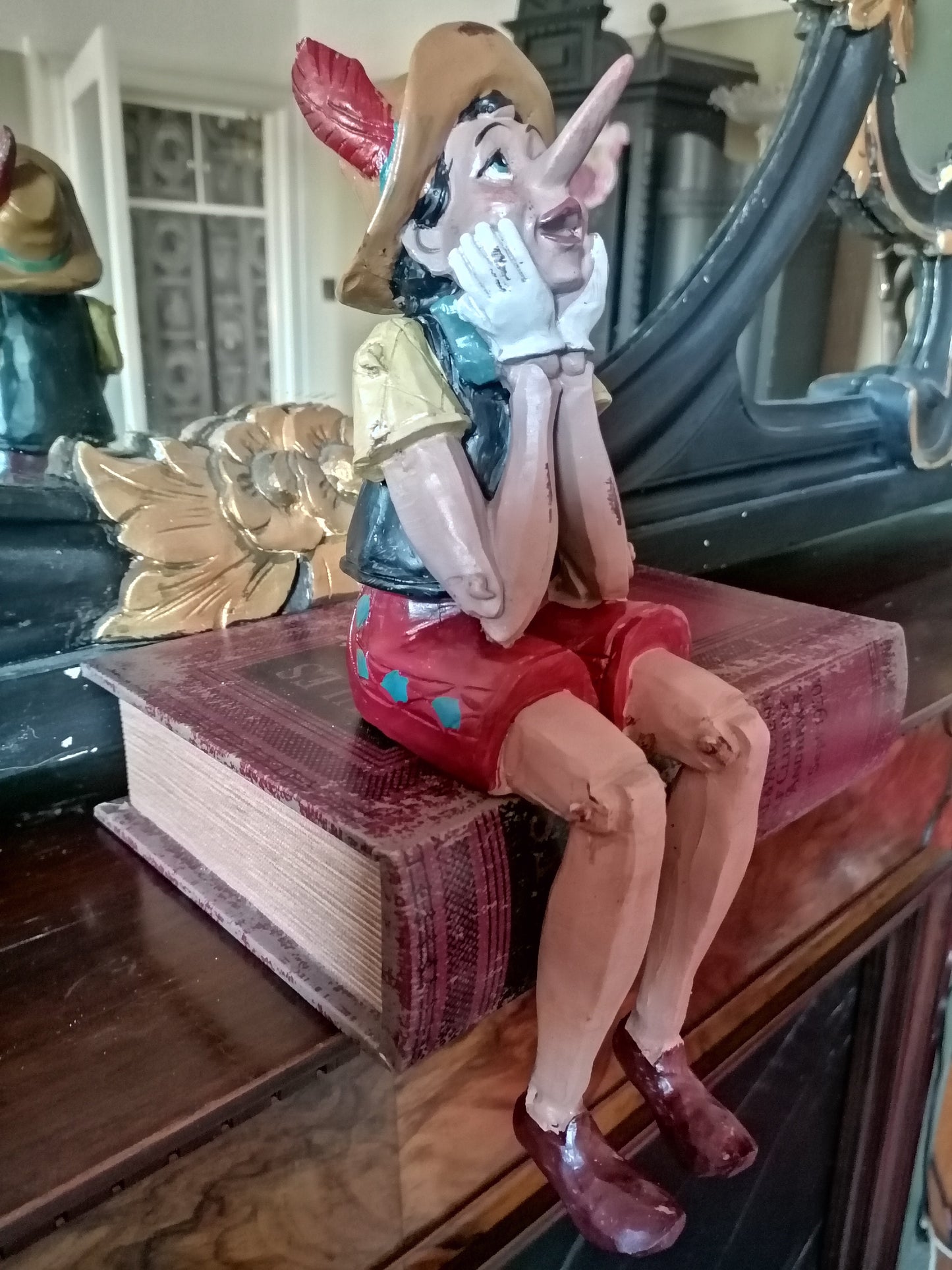 Antiqued Sitting Pinocchio figure